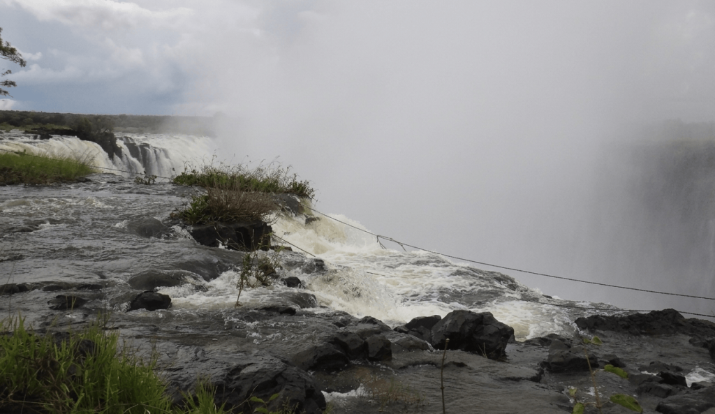 Safety lines and natural rock barriers at Devil's Pool, Victoria Falls